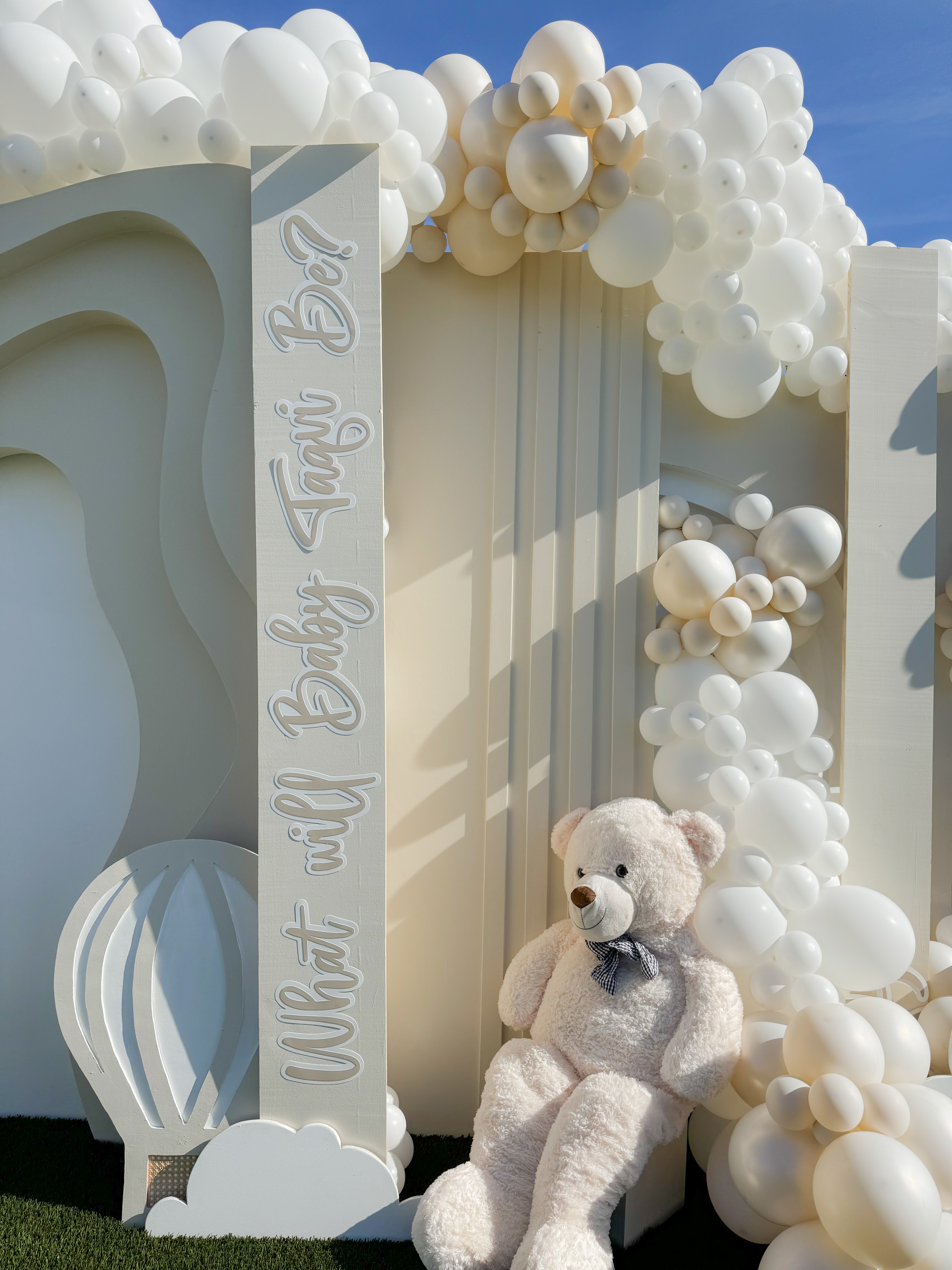 White arch with loveseat and candles